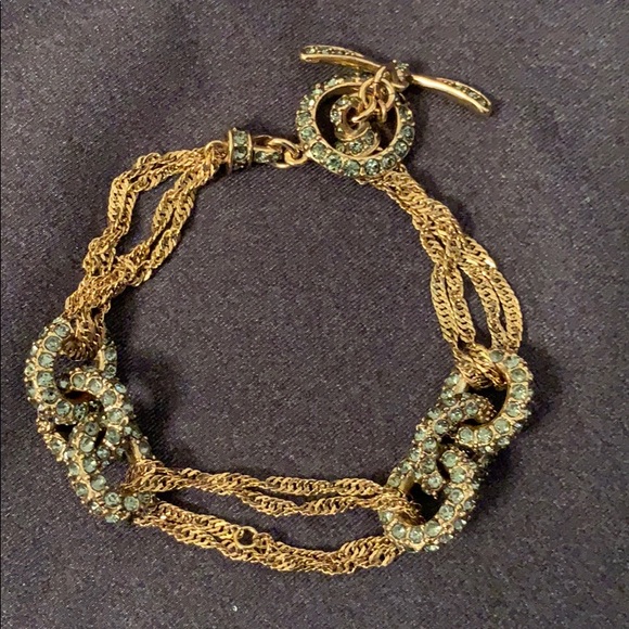 Monet gold tone bracelet with green crystals